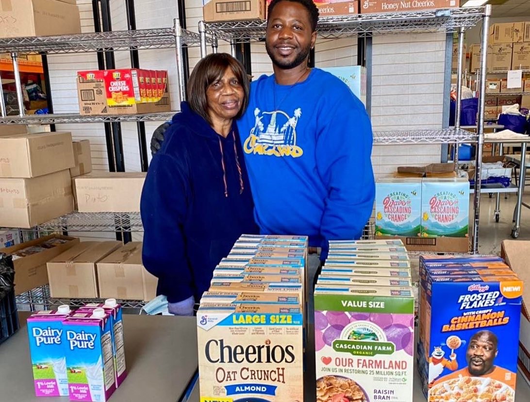 EOC staff member Champ with Ms. Sylvia at the food distribution warehouse
